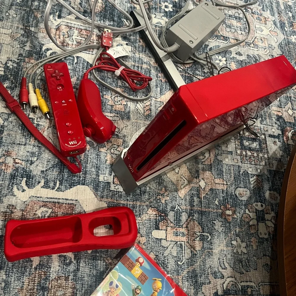 Nintendo Wii in Vibrant Red with Accessories controller. Some times. Works.